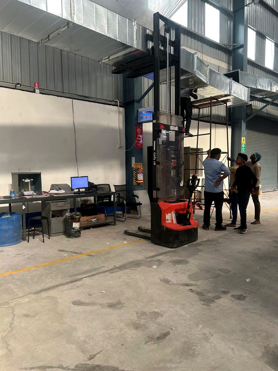 Galvanised ducting being installed at a packaging plant
